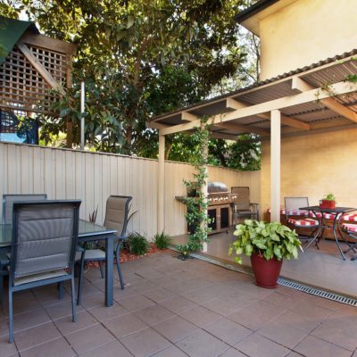 back yard with outdoor seating and barbecue with family