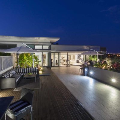Modern balcony at sunset in luxury penthouse